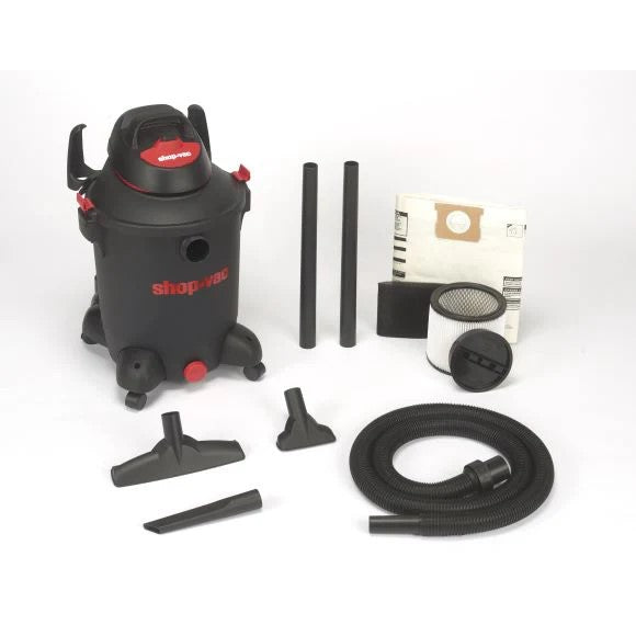 Photo of a black shop-vac vacuum with included accessories on a white background