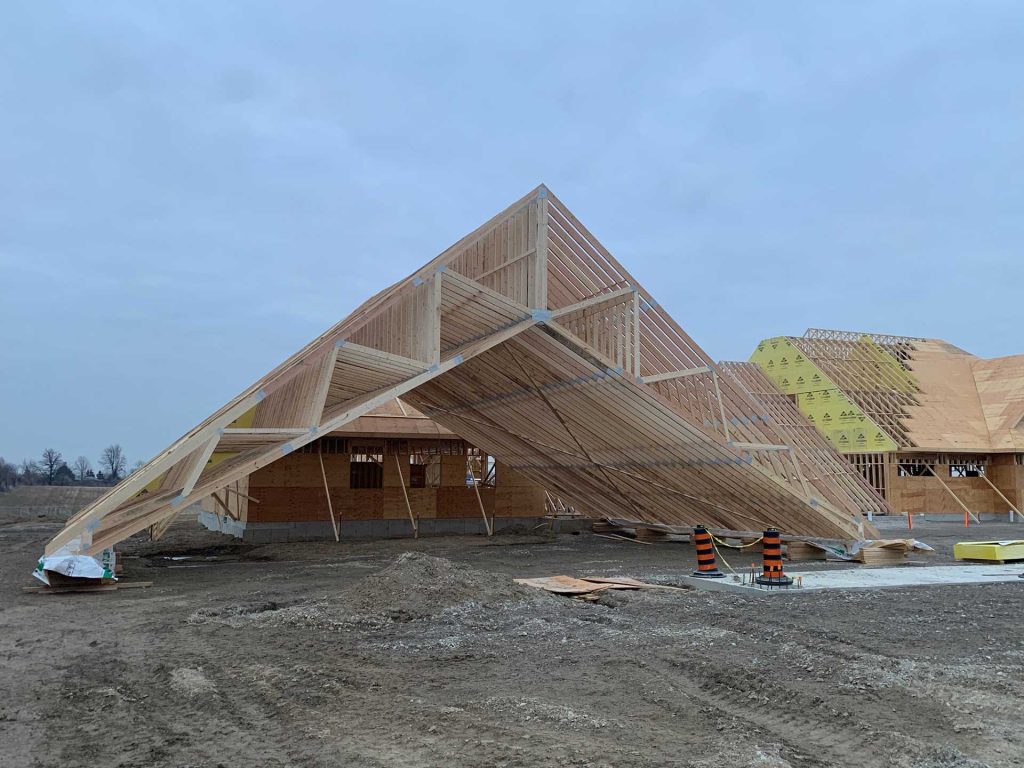 An image of a set of trusses waiting to be installed on a home