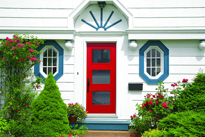 A red Mastergrain Exterior Door with three doorlights for both natural light and privacy