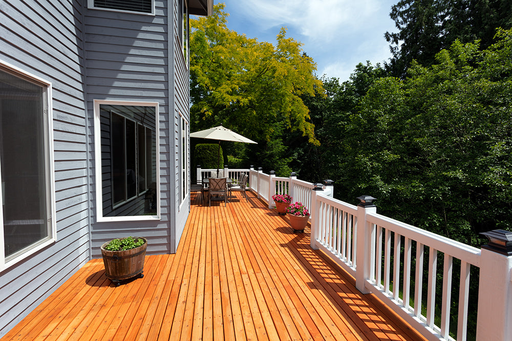 A long cedar deck with white pvc railings