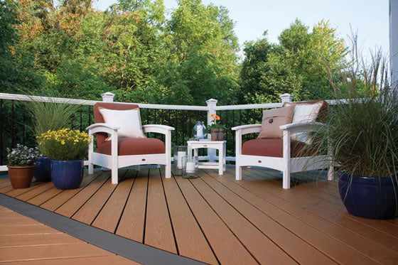 A brown and black composite deck with metal balusters