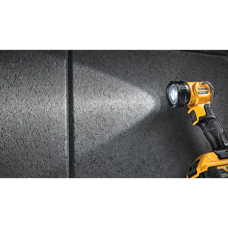 DeWalt cordless flashlight illuminating a dark surface
