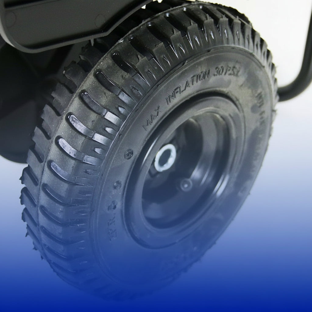 Close-up of a 9-inch pneumatic tire with tread pattern on a reflective surface.