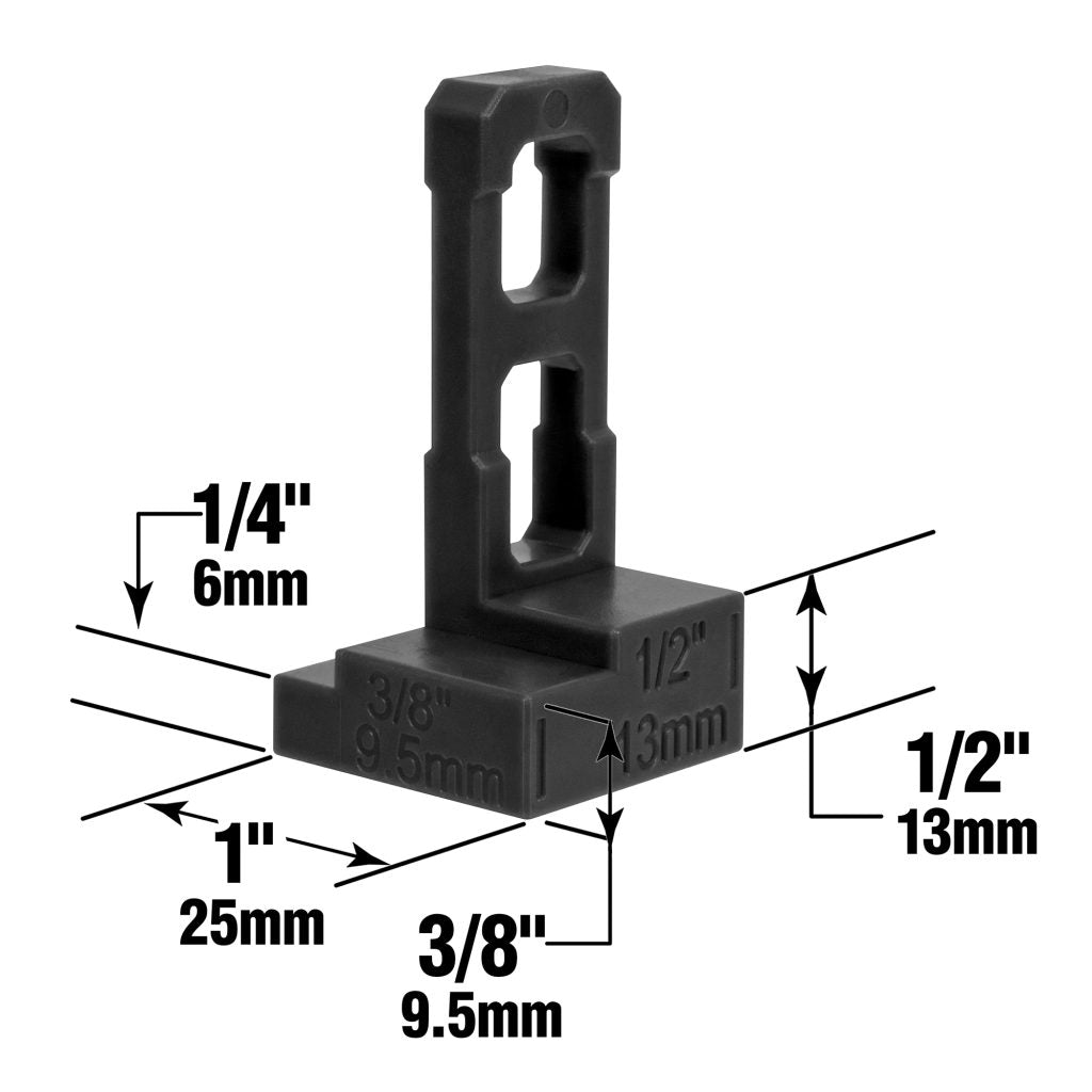 The Roberts Pro Flooring Installation Kit features a black plastic measuring tool with clearly labeled increments: 1/4 inch (6mm), 3/8 inch (9.5mm), 1/2 inch (13mm), and 1 inch (25mm). Arrows and text mark each measurement on various sides and slots of the tool, making it perfect for vinyl or laminate flooring installation projects.