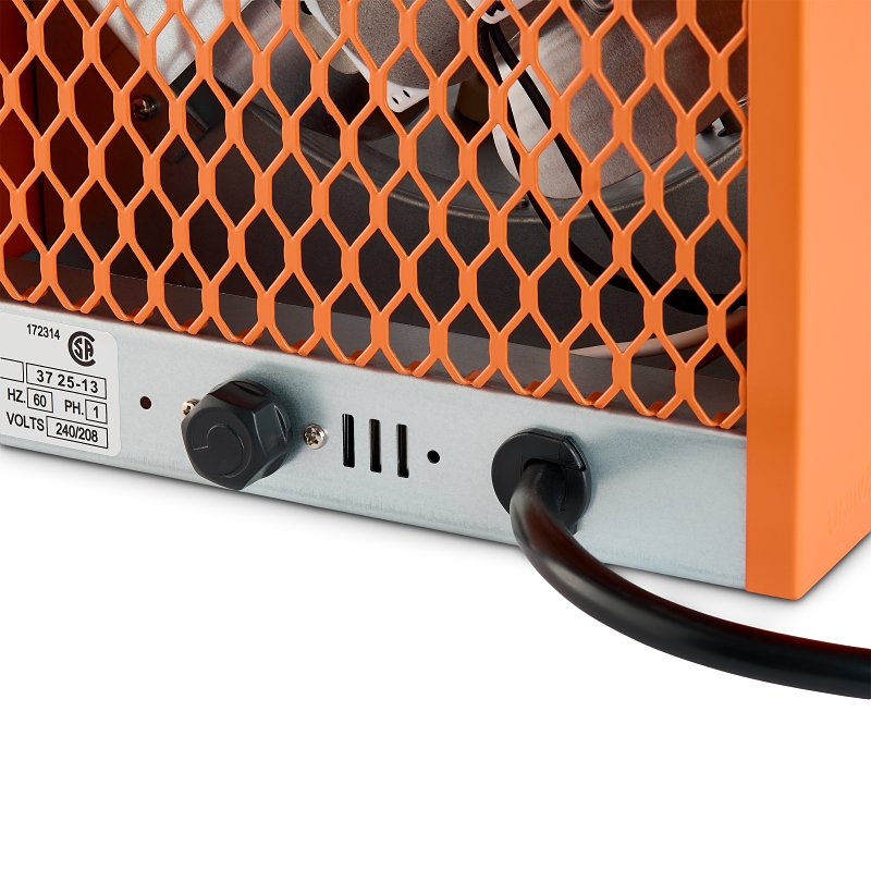Close-up of the base of an orange UCH Portable Heater by STELPRO DESIGN showing a metal mesh grill, a power cord, a black control knob, and a product specification label.