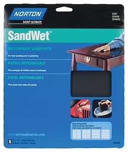 A package of Norton Super Fine 400 Grit Paper Sheets, with visible sheets inside and images of hands sanding a table and car part. The blue packaging displays white and yellow text.