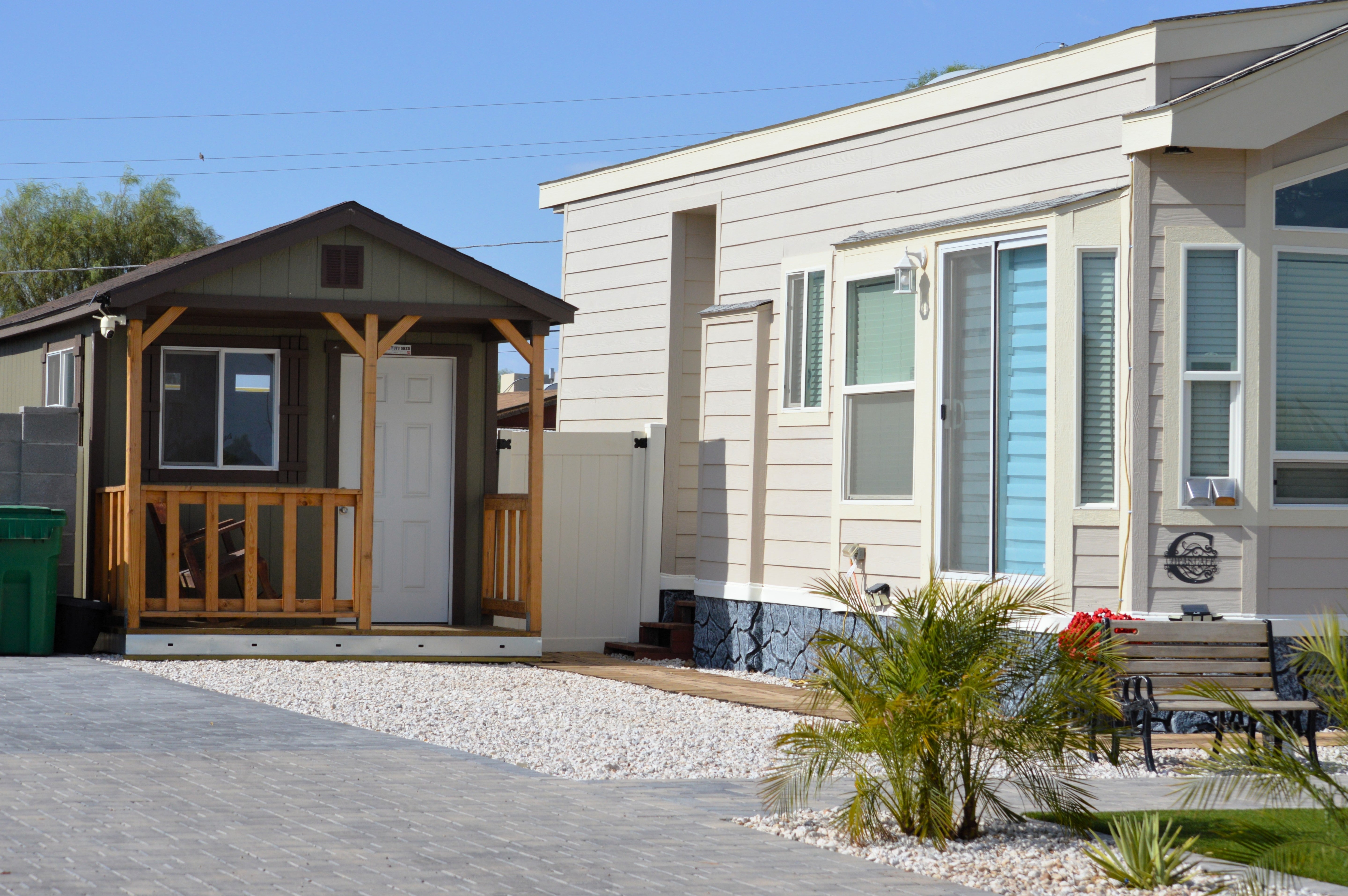 A tiny home additional dwelling unit on a property with a main house.