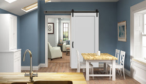 A modern kitchen with light blue walls, eco-friendly wood fiber floors, a wooden countertop, stainless steel faucet, white dining chairs, and a Jeld-Wen Madison 1-Panel Recessed Slab sliding door leading to a cozy living room.