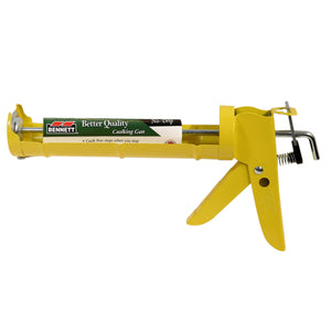 Yellow metal Bennett Tools Canada No Drip Caulking Gun with a trigger handle and a label stating Better Quality.