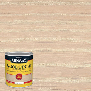A 236ml can of Minwax Wood Finish in Simply White from Sherwin Williams Canada (Minwax) sits in front of a wooden surface coated in a light, whitewashed stain that brightens the wood and neutralizes its undertones.