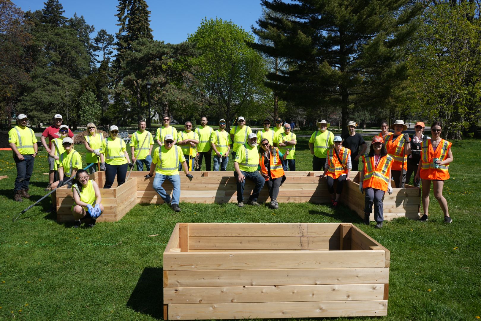 The Turkstra team posing with the community garden they help build