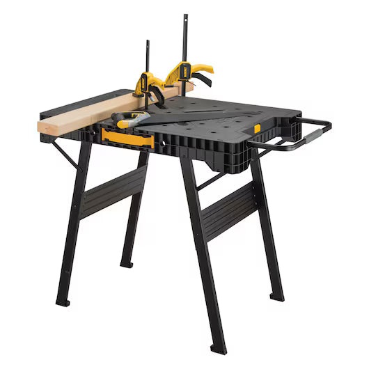 A Dewalt Folding Workbench by TurkstraLumberLtd in black and yellow, featuring foldable legs and a wooden board held securely on its surface with two clamps.
