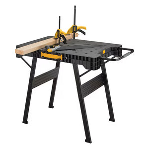 A Dewalt Folding Workbench by TurkstraLumberLtd in black and yellow, featuring foldable legs and a wooden board held securely on its surface with two clamps.