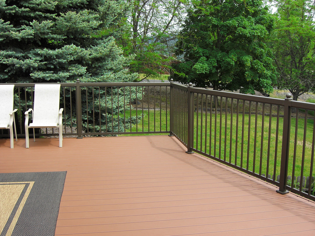 Dark brown Regal aluminum picket railings on a light brown composite deck