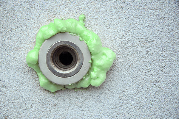 Green IPF Gun Foam applied to seal a gap