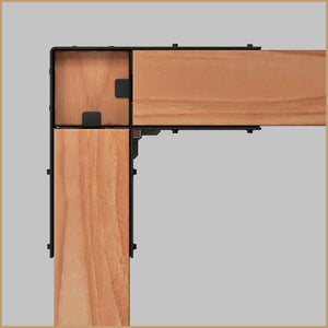 Top-down view of a corner joint connecting two wooden beams with a Simpson Strong-Tie® Sage Corner Connector for 6x6, Black (2 per Pack), against a light gray background.