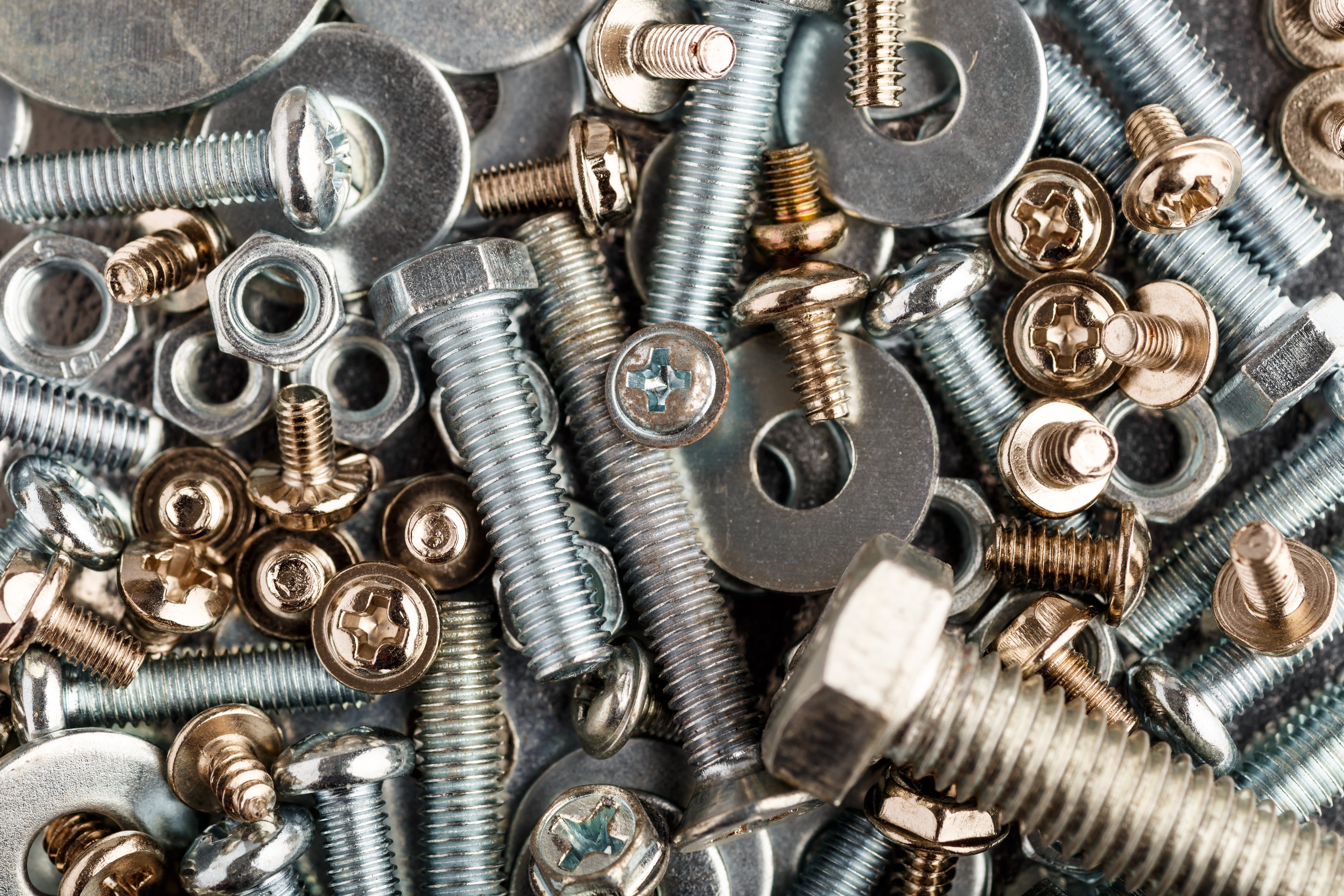 Close-up of various screws and bolts with different sizes and colors.