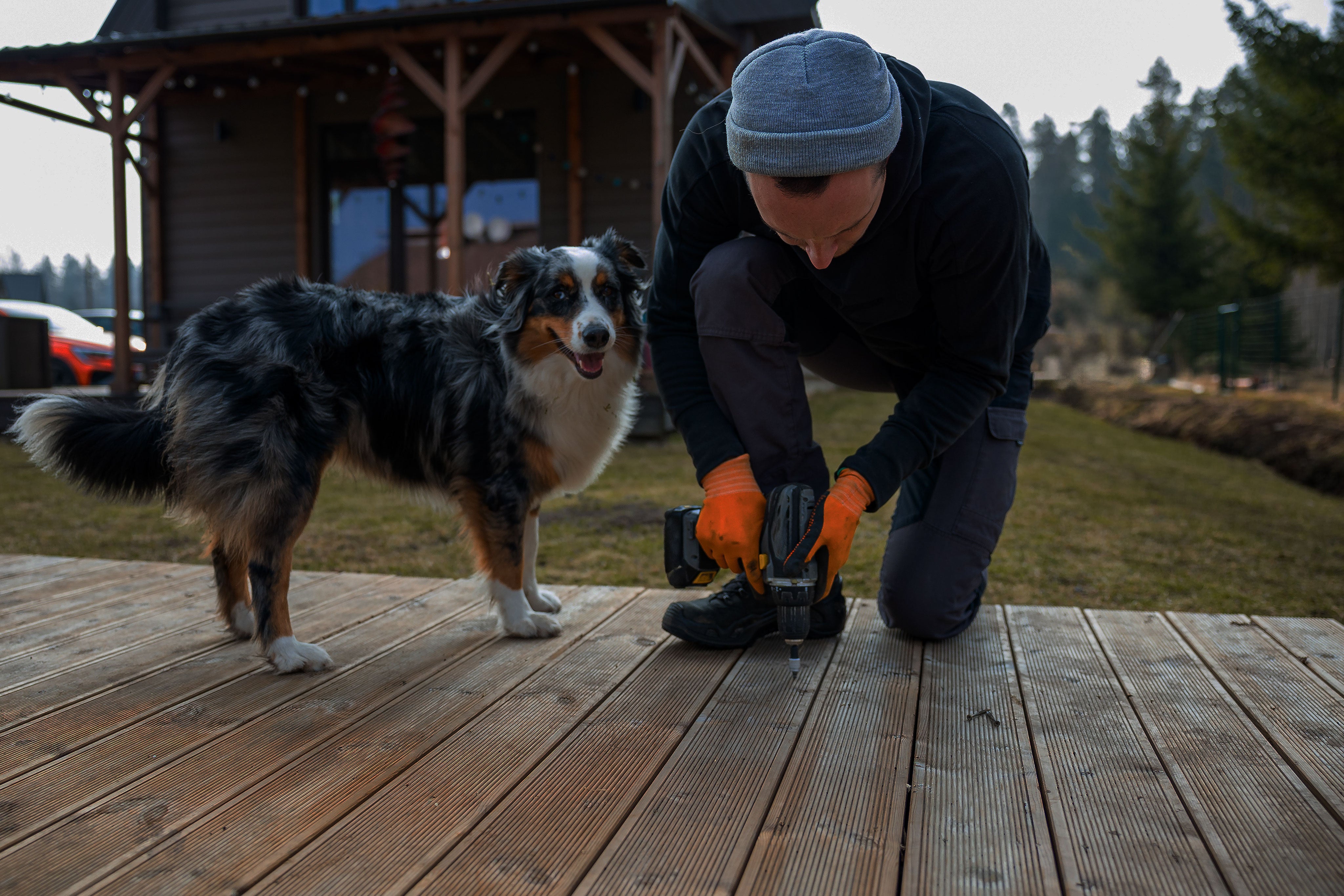Building a deck with his dog. Do it yourself with Build-It-Better.