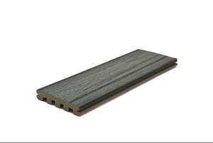 A single 1" x 6" x 12' Trex Enhance Basics Grooved deck board in Pebble Beach, featuring a wood grain texture and gray finish, is shown on a white background.