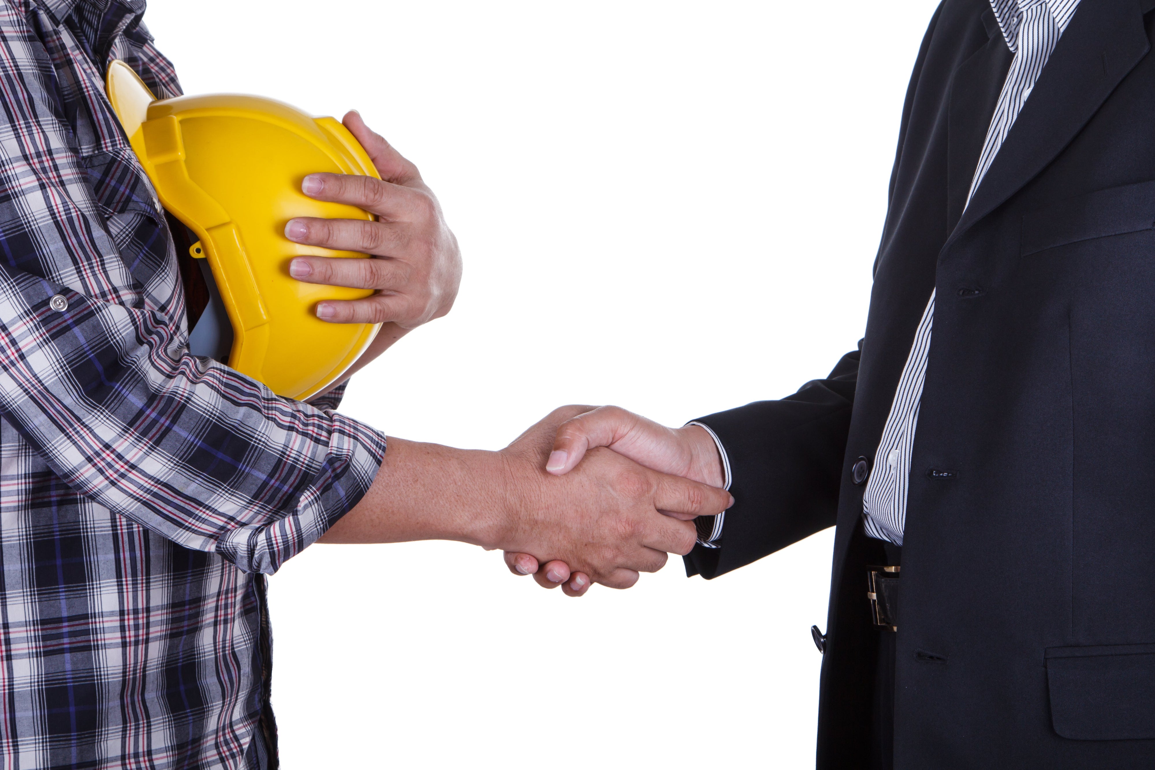 A person in a plaid shirt holding a yellow construction helmet shakes hands with someone in a suit, symbolizing an agreement or partnership, against a plain white background.
